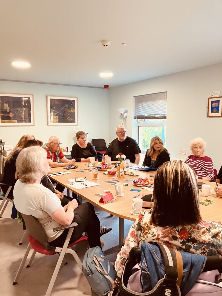 Kaukab Stewart, Minister for Equalities, sits listening to a group of parent carers at Vocal's Midlothian Carer Centre.
